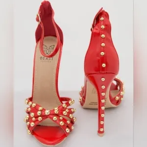 Red strappy heels with gold studs