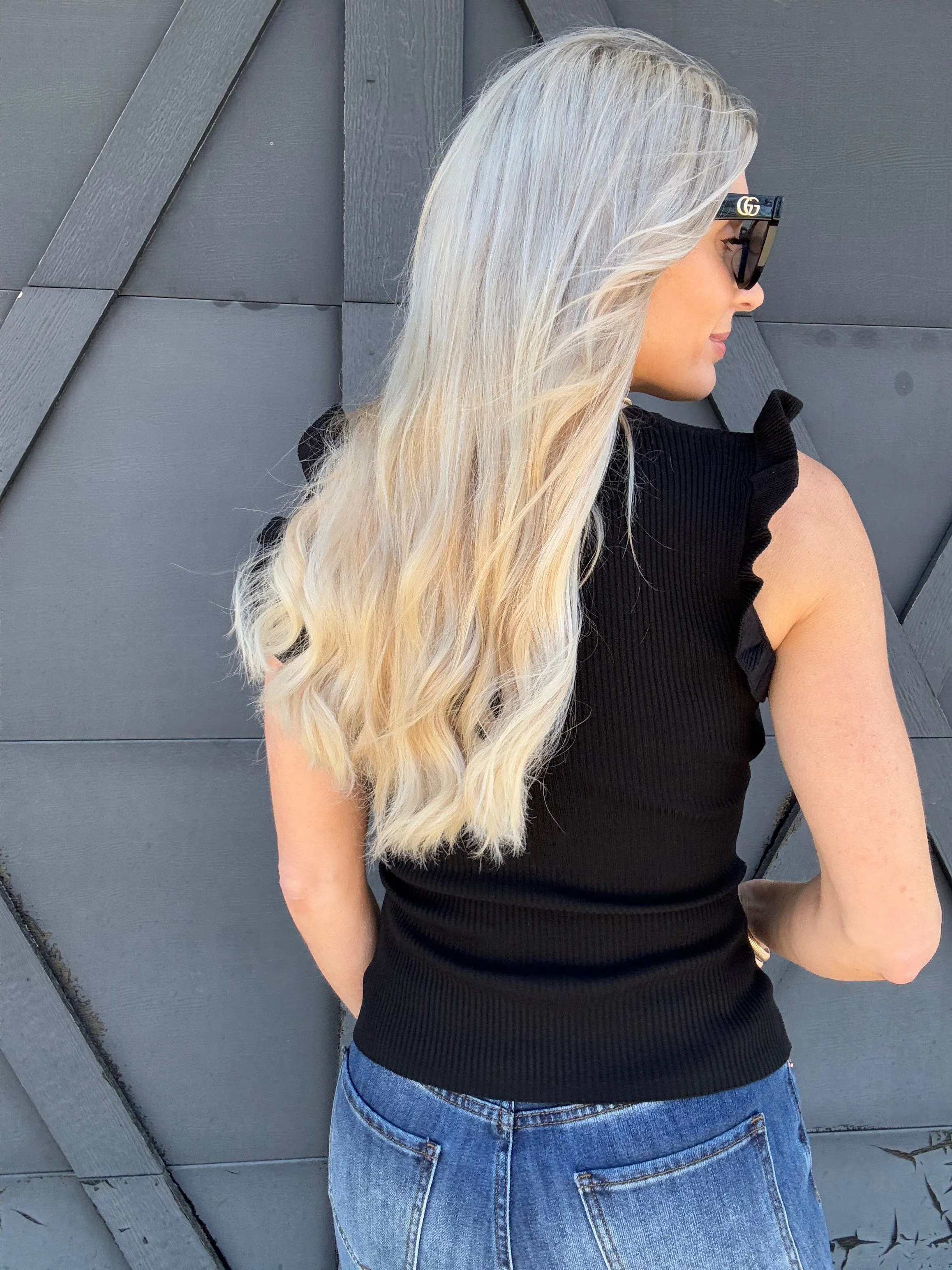 Sleeveless Ruffle Sweater Top In Black