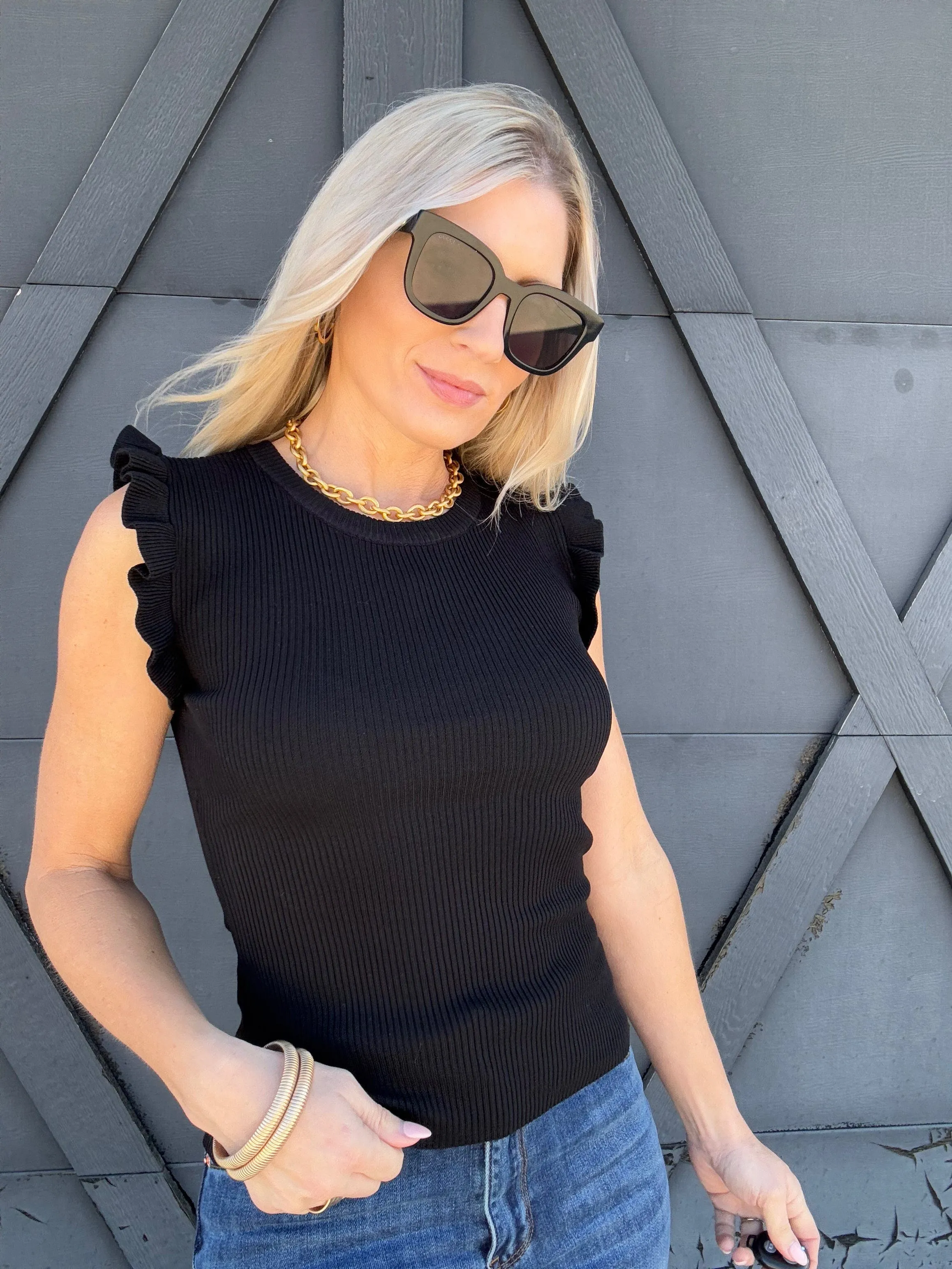 Sleeveless Ruffle Sweater Top In Black