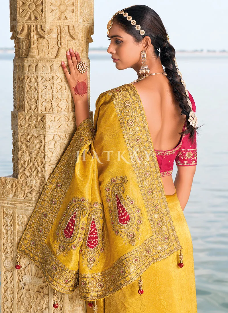 Yellow And Magenta Handwork Embroidery Wedding Saree